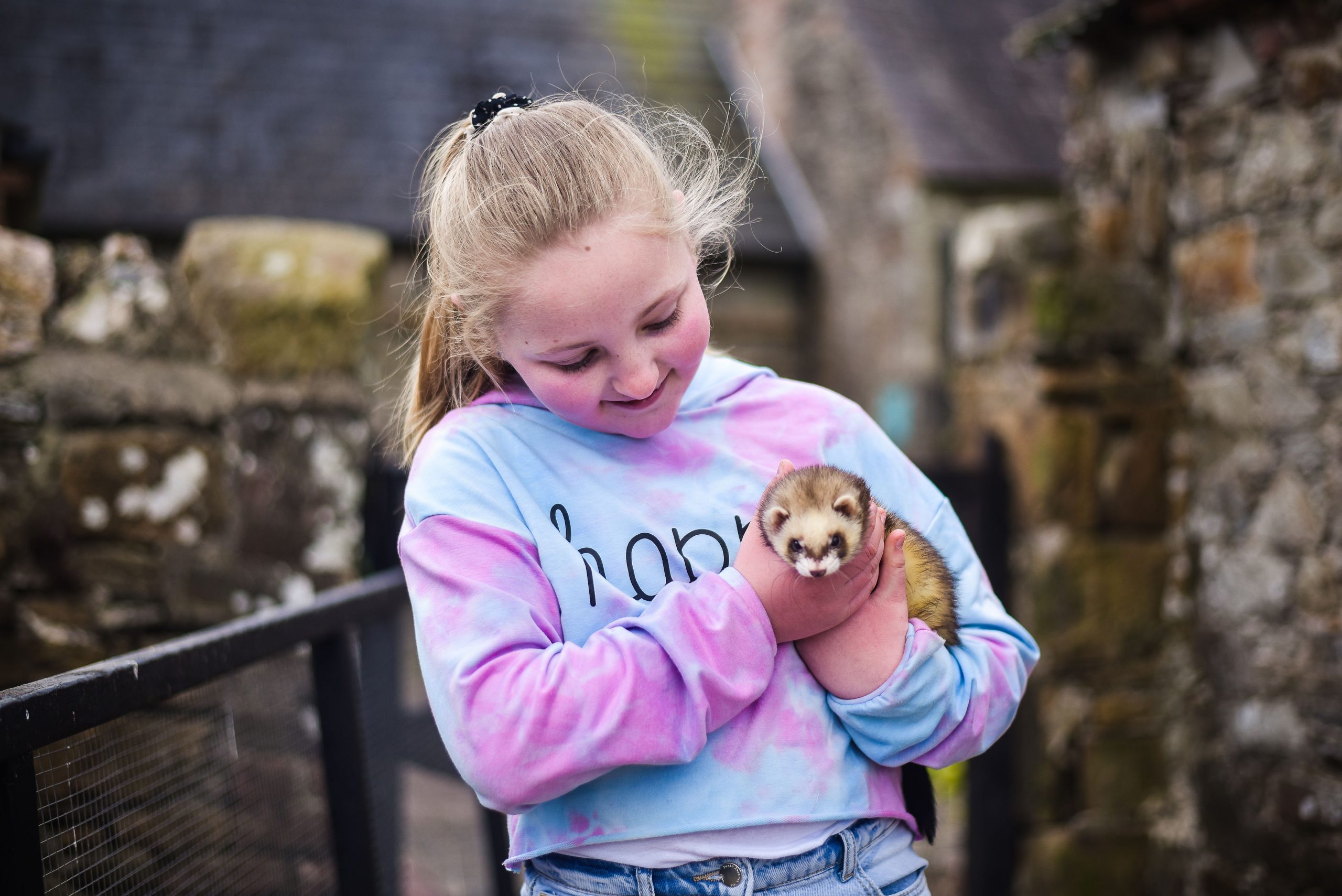 Little girl holding a fury animal